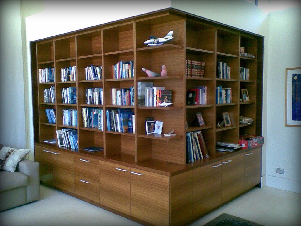 A Large Wooden Bookshelf With Drawers — Plumbe Joinery in Coffs Harbour, NSW