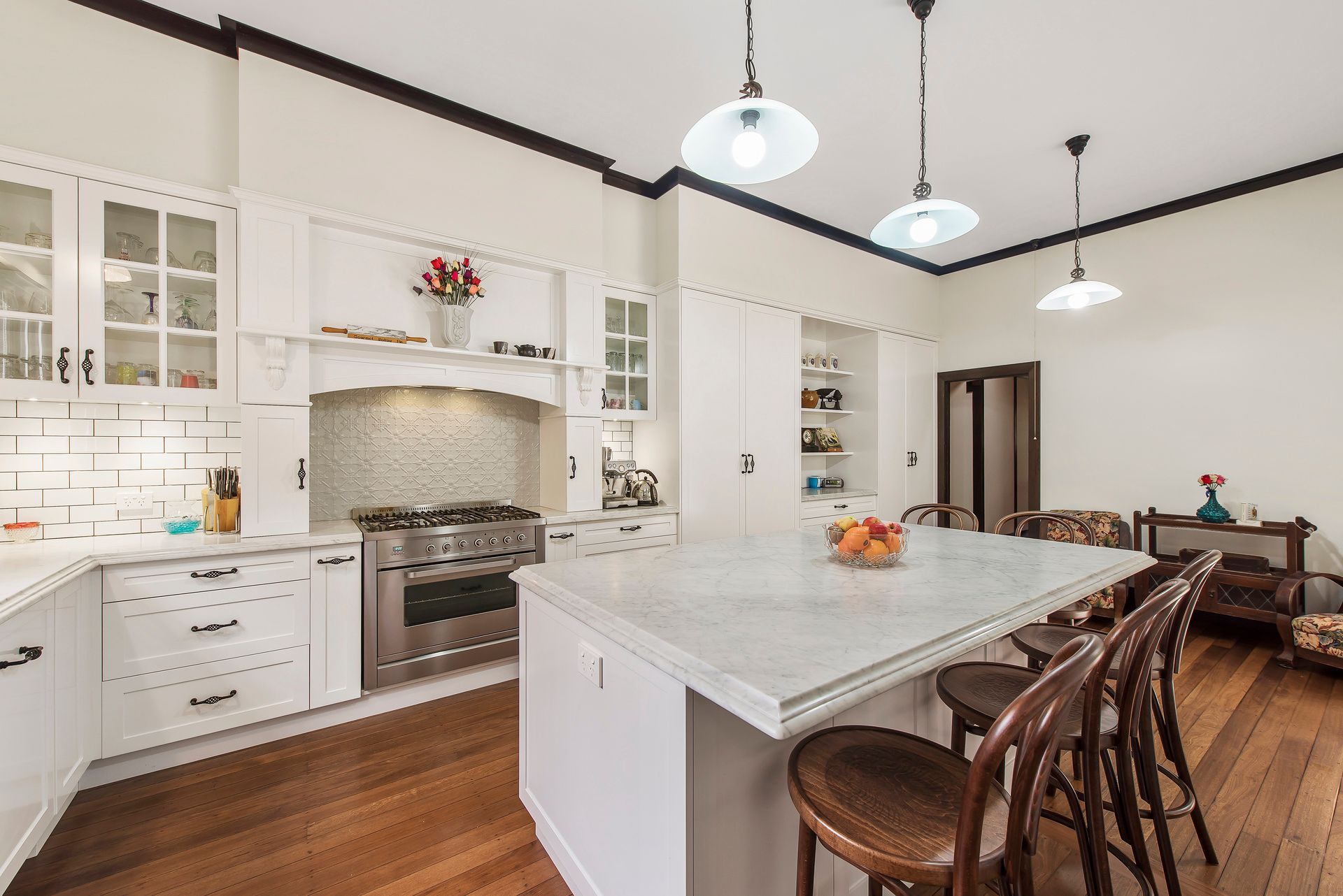 A Kitchen With White Cabinets , and Wooden Floors — Plumbe Joinery in Coffs Harbour, NSW