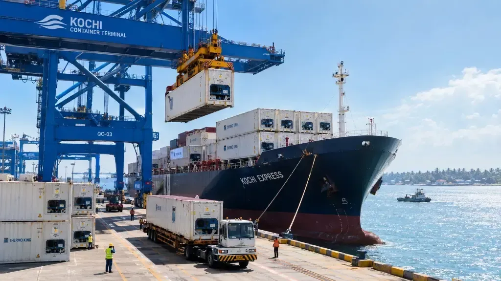 Refrigerated cargo containers being loaded at a port in Kochi, Kerala