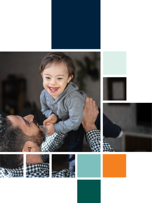 A man is holding a baby in his arms.