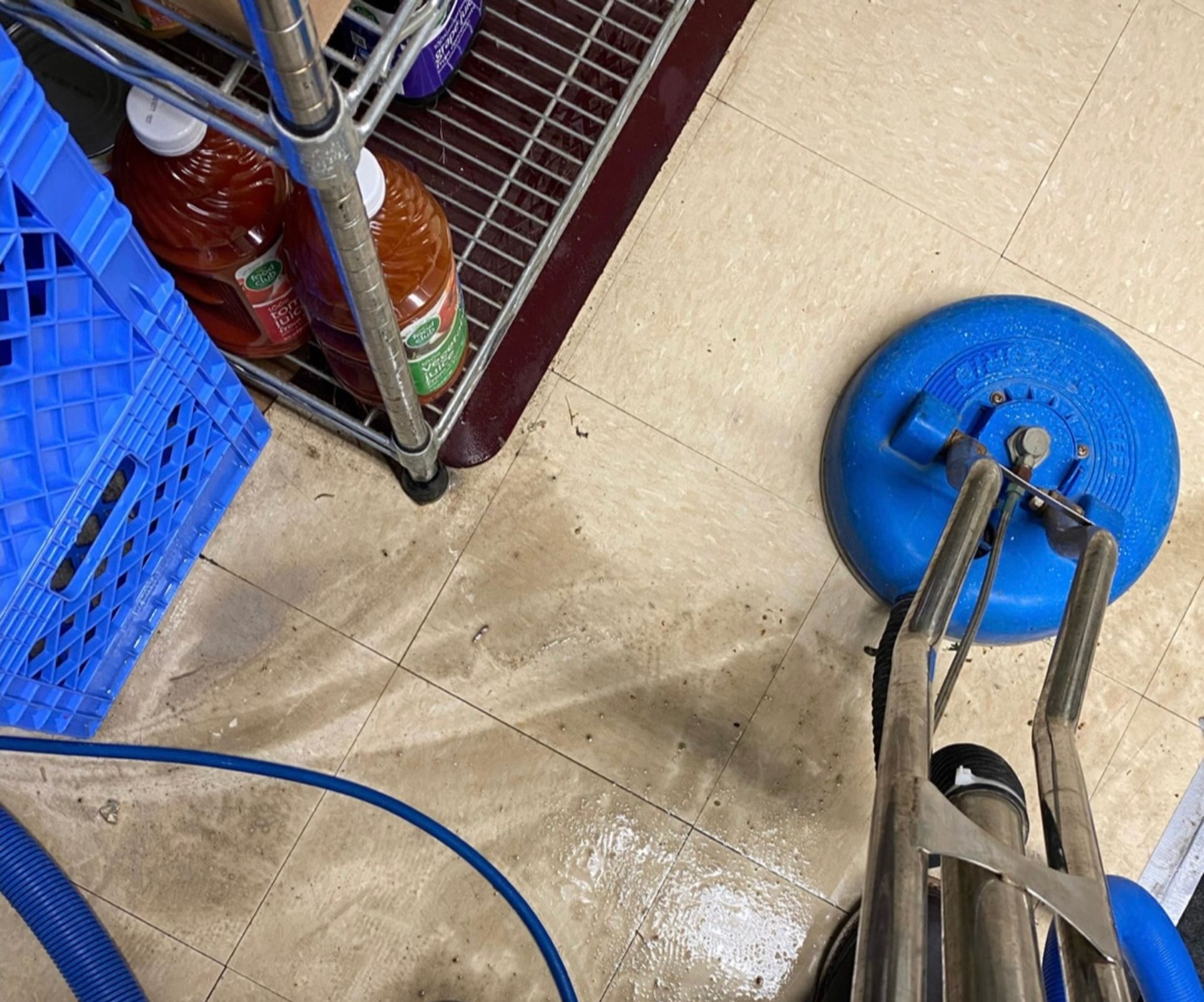 A person is standing next to a machine that says xtreme carpet care