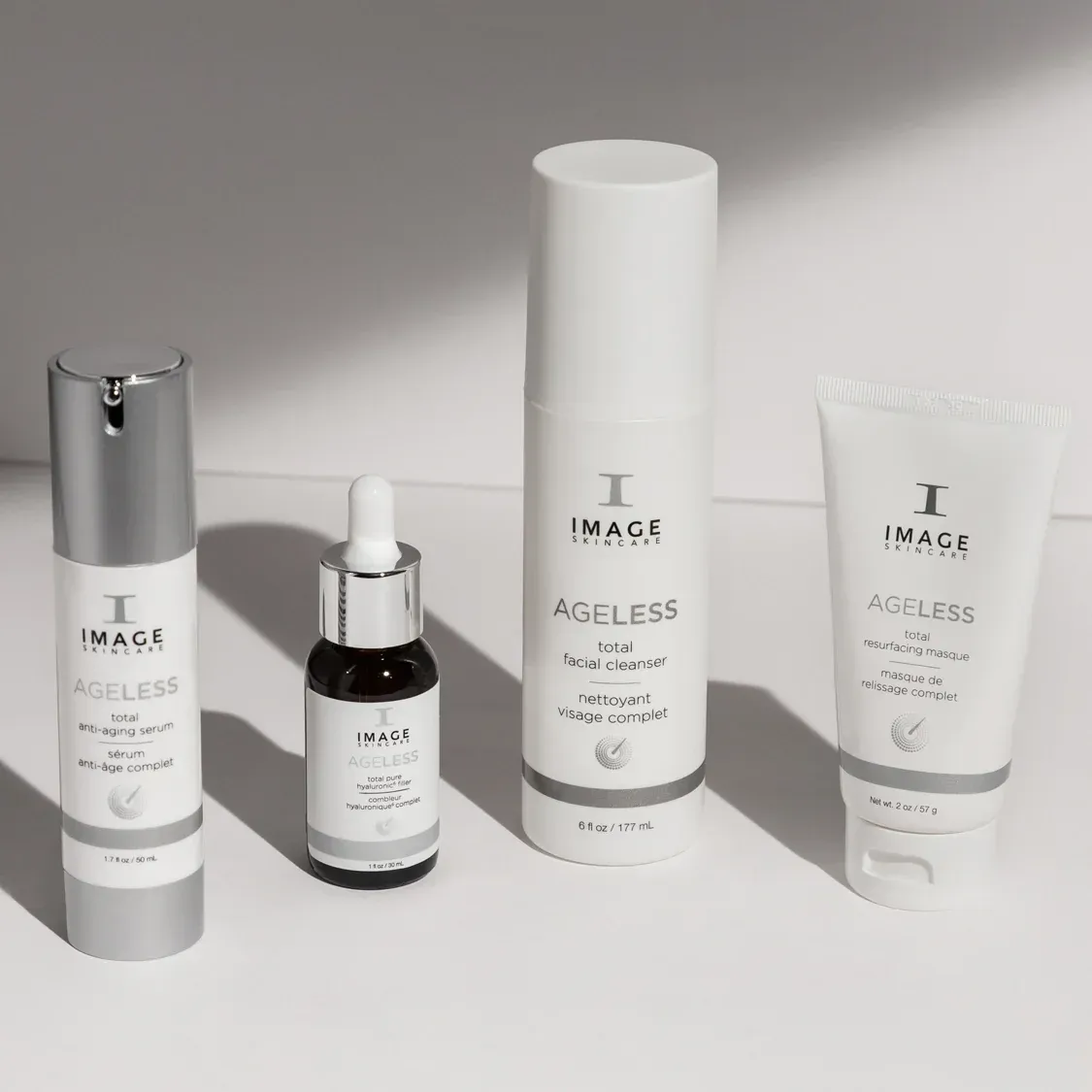 Four Image Skincare AGELESS anti-aging skincare products arranged on a white surface.
