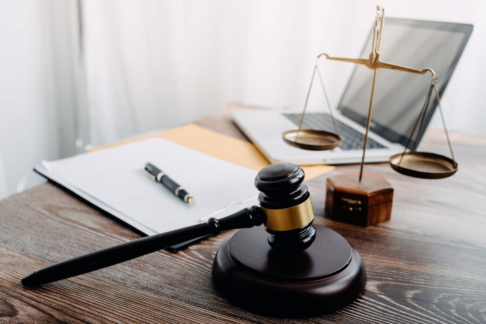 Papers With Brass Scale On Desk In Office