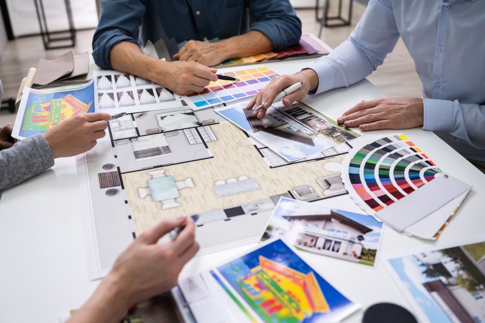 People Collaborating on Architectural Plans — Jamie Frankham Painting in Goonellabah, NSW