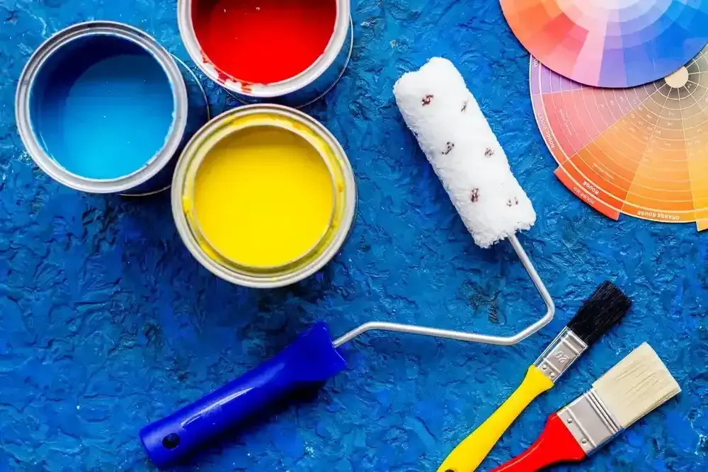 Open Paint Cans (Blue, Red, Yellow) — Jamie Frankham Painting in Casino, NSW