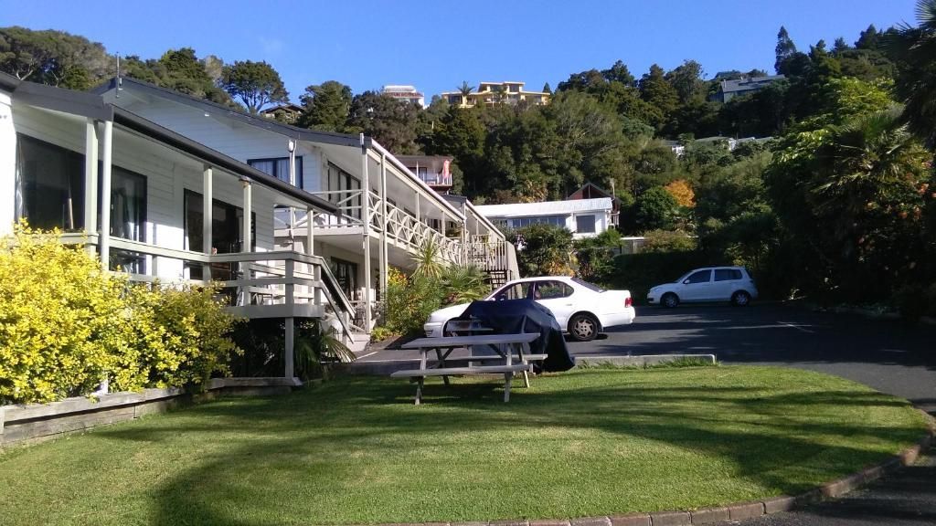 A motel with a picnic table in front of it