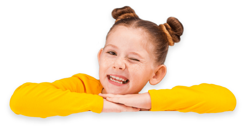 a little girl in a yellow sweater is winking and smiling