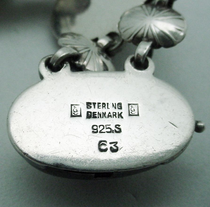 Silver jewelry piece with hallmarks: 