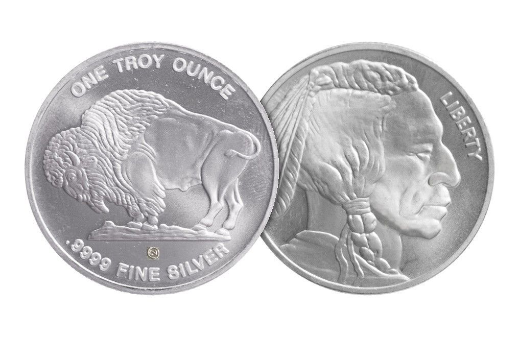 Silver coin with a buffalo and a Native American profile.