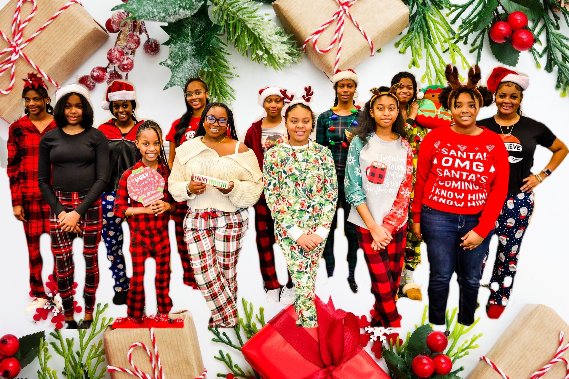 Group of people in Christmas pajamas, posing with gifts and holiday decorations.
