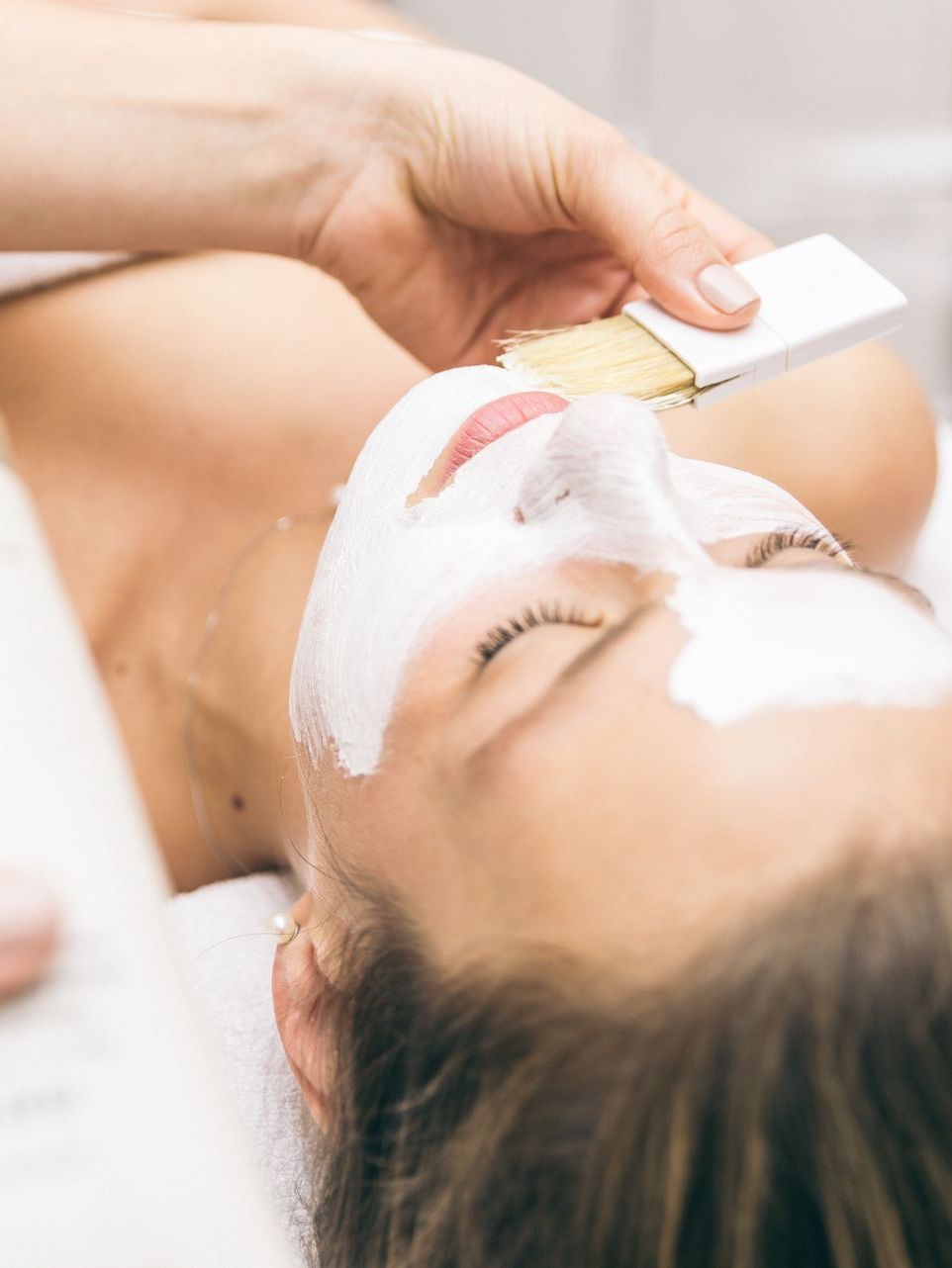 woman making facial treatment