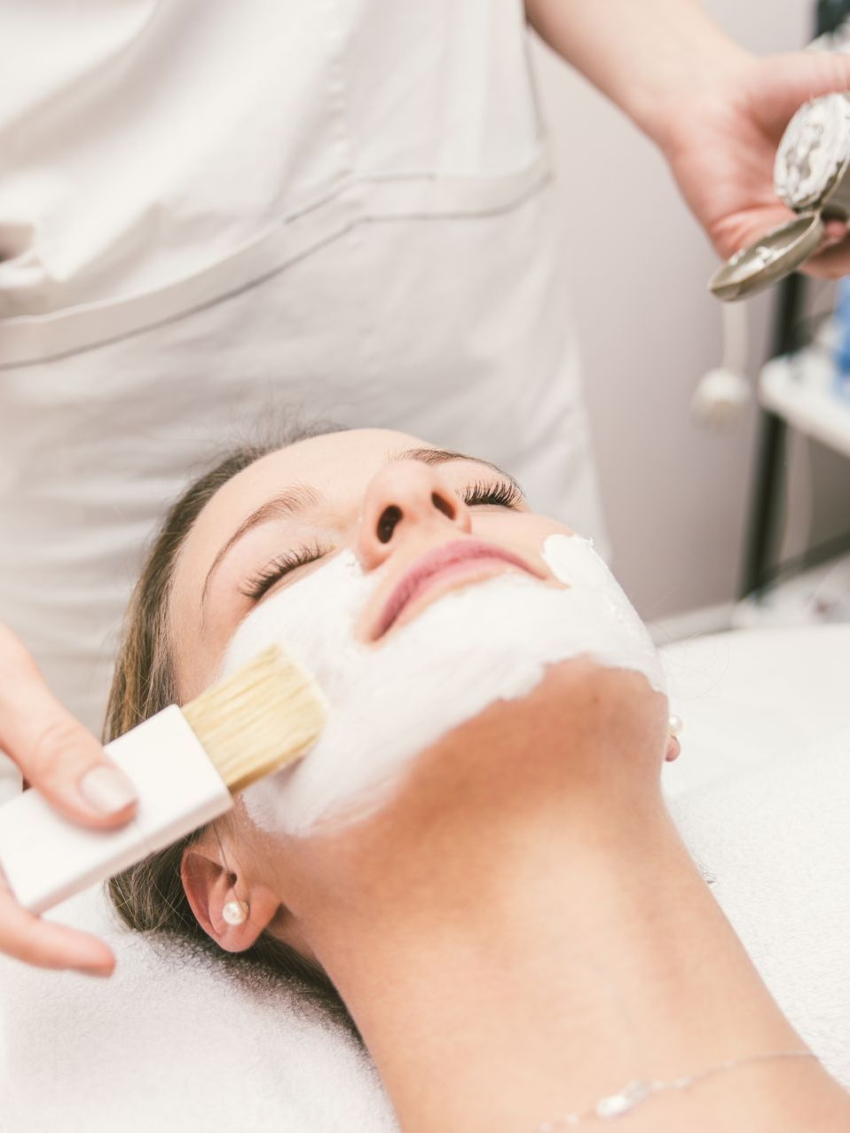 woman making facial treatment