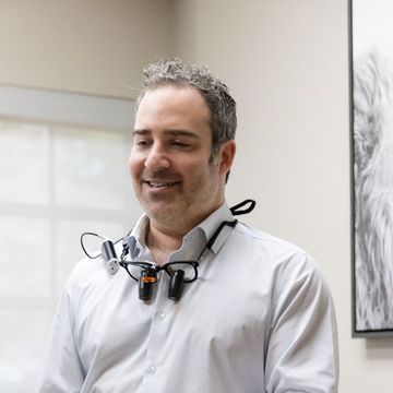 Dr. Andrew Browne smiling in his Pompano Beach dental office
