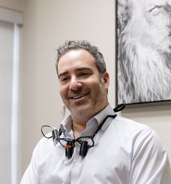 Dr. Andrew Browne smiling in a treatment room at My Pompano Dentist