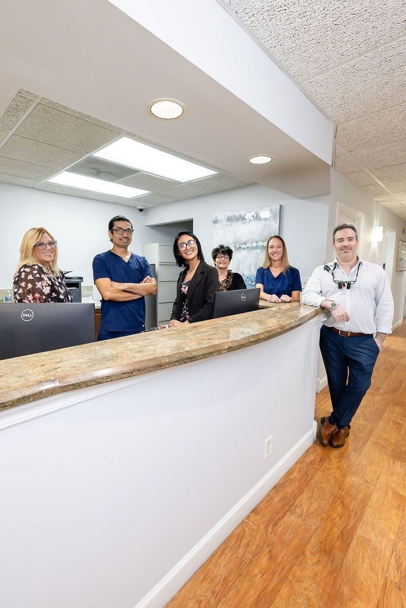 The My Pompano Dentist team behind the front desk