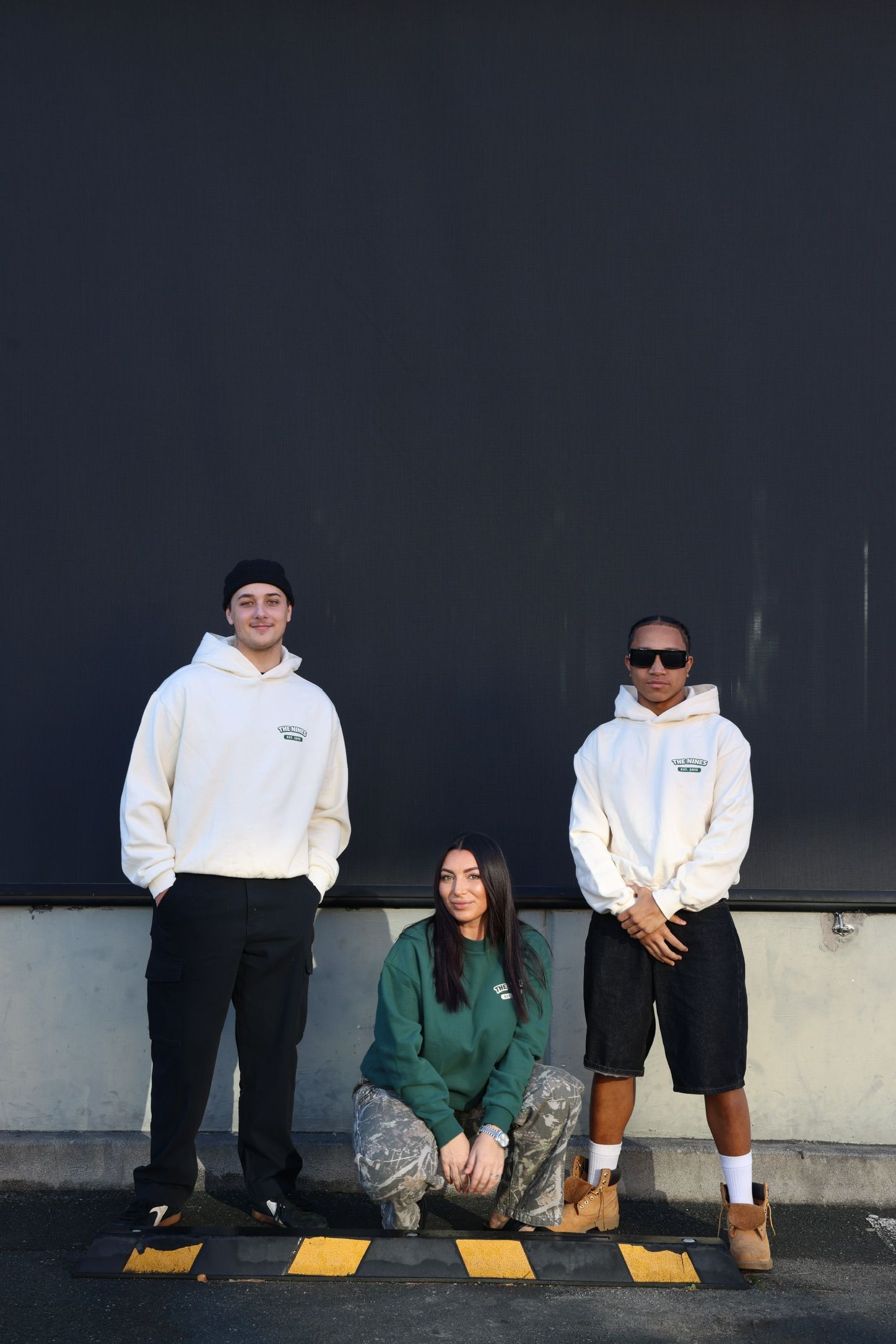 2 guys and 1 girl posing in merchandise from The Nines Cafe Maroochydore