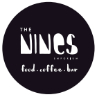 The nines food and coffee bar logo is a green food box with light yellow background