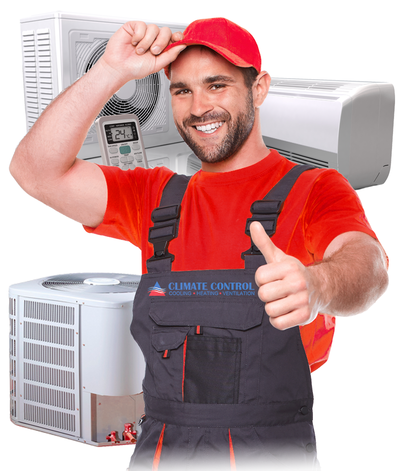 Smiling HVAC technician in red cap and shirt giving thumbs-up beside air conditioning units