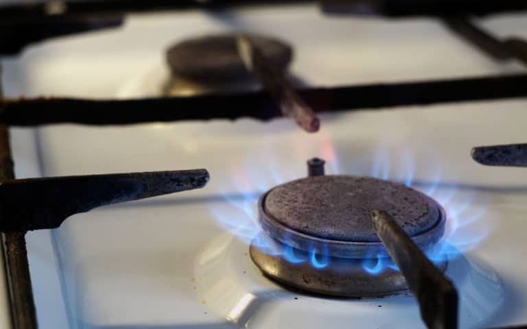 A Close Up Of A Gas Stove With A Blue Flame Coming Out Of It — ARK Plumbing & Gasfitting In Bundanoon, NSW
