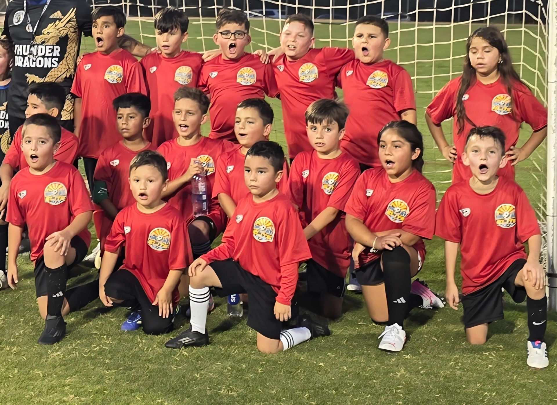 children soccer team having a photo