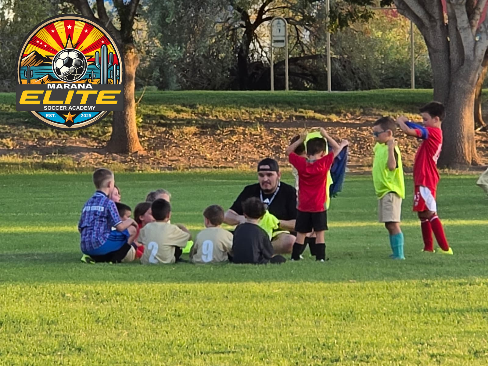 Marana Elite coach and young soccer players together at practice