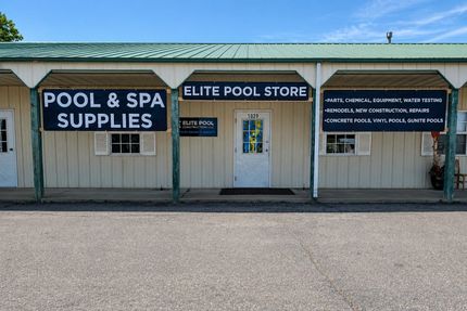 Picture of the exterior of a green and beige pool supplies store