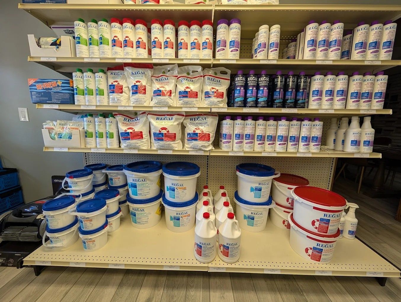 Shelves stocked with assorted dairy products in a grocery store aisle