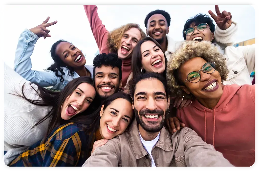 A group of people are taking a selfie together.