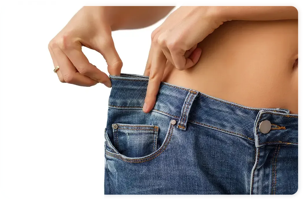 A woman is measuring her waist with her finger