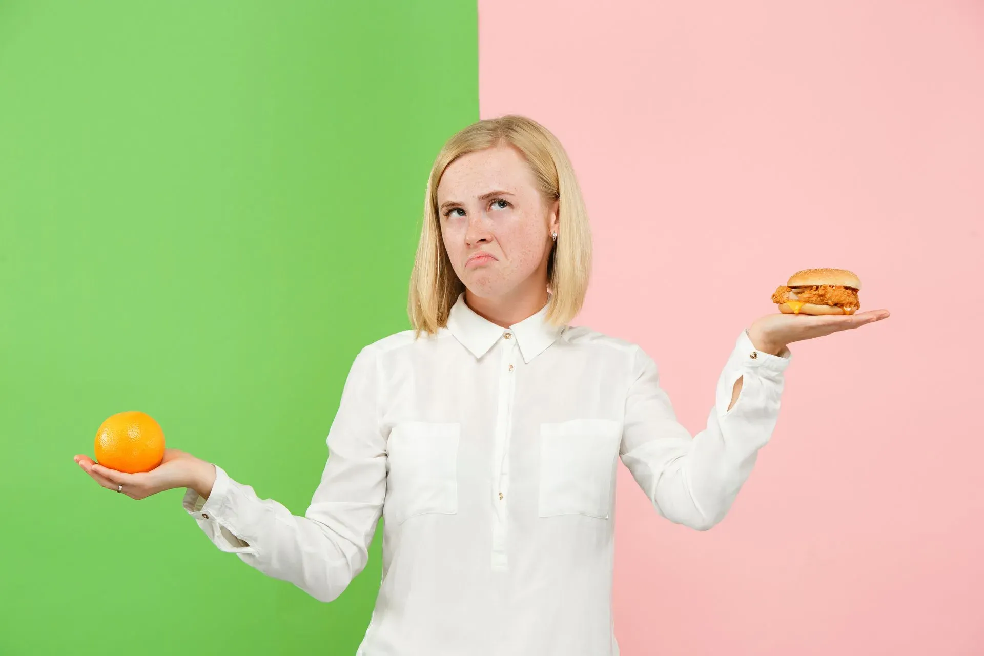 woman choosing between healthy and unhealthy