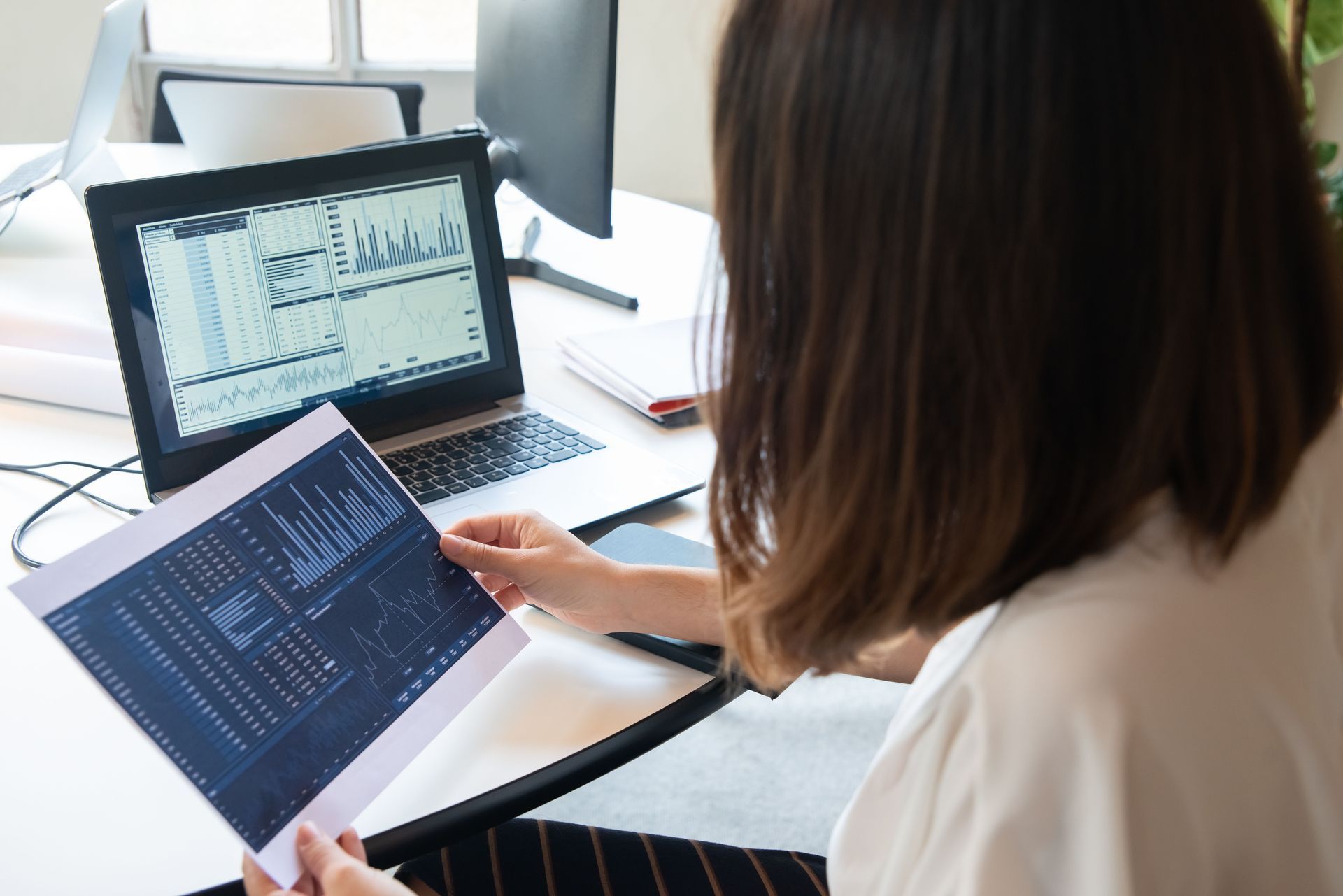 A Nashville business owner reviewing a clean financial dashboard with a CPA advisor