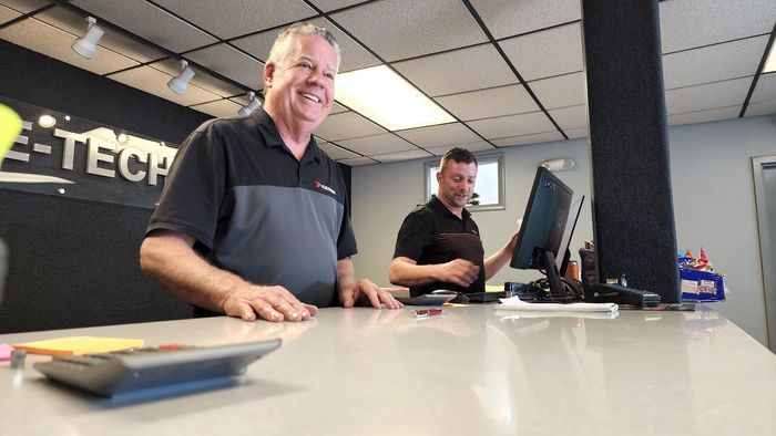Men at the Counter | Tire Tech