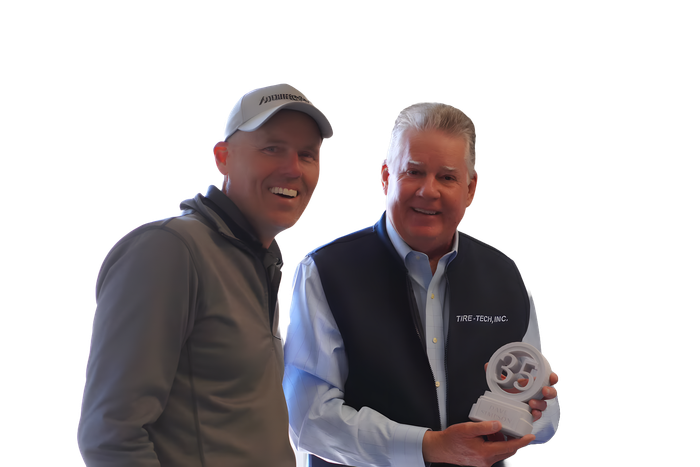 Two Men Smiling in Front | Tire Tech