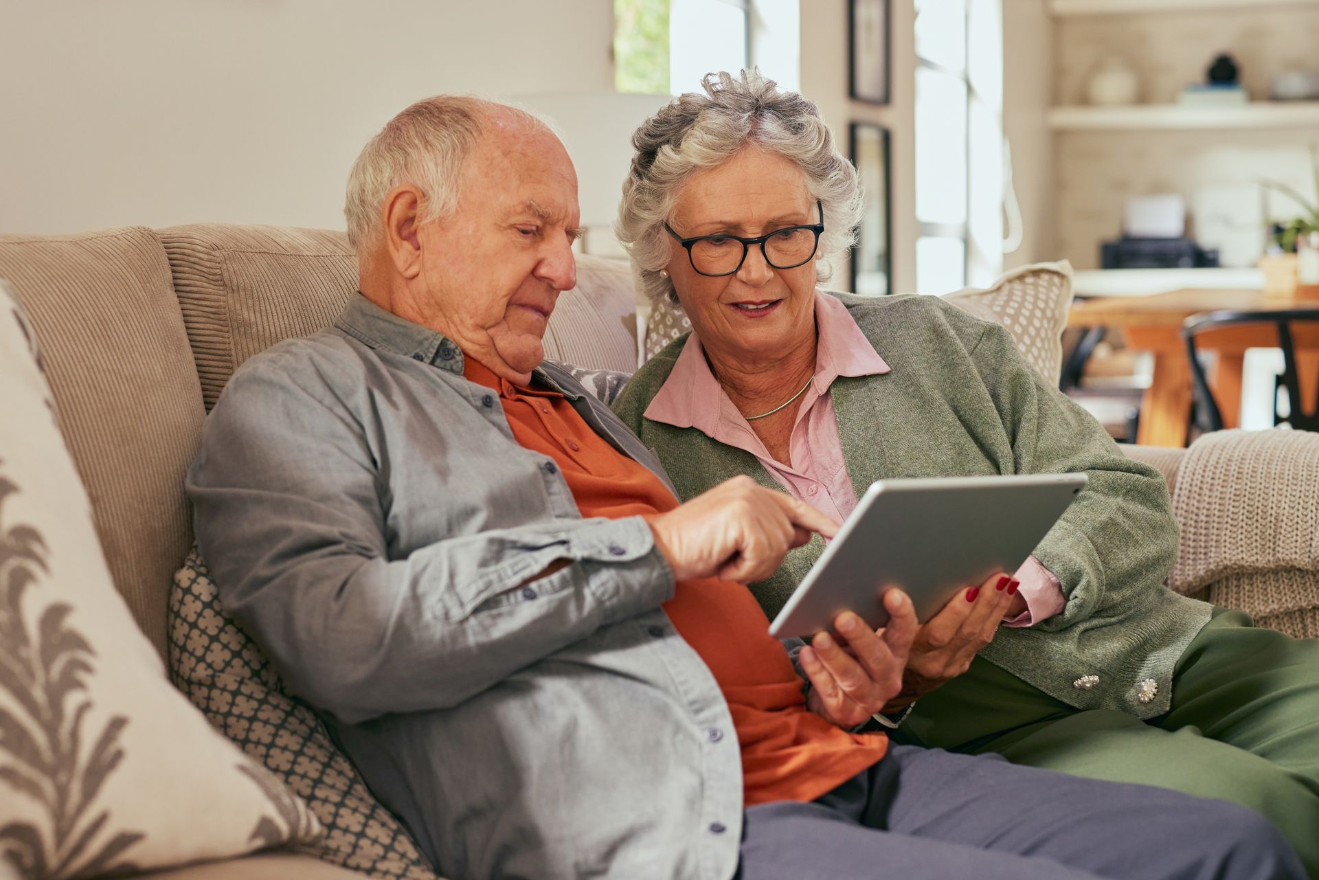 Patients visiting a medical website on a table from their sofa