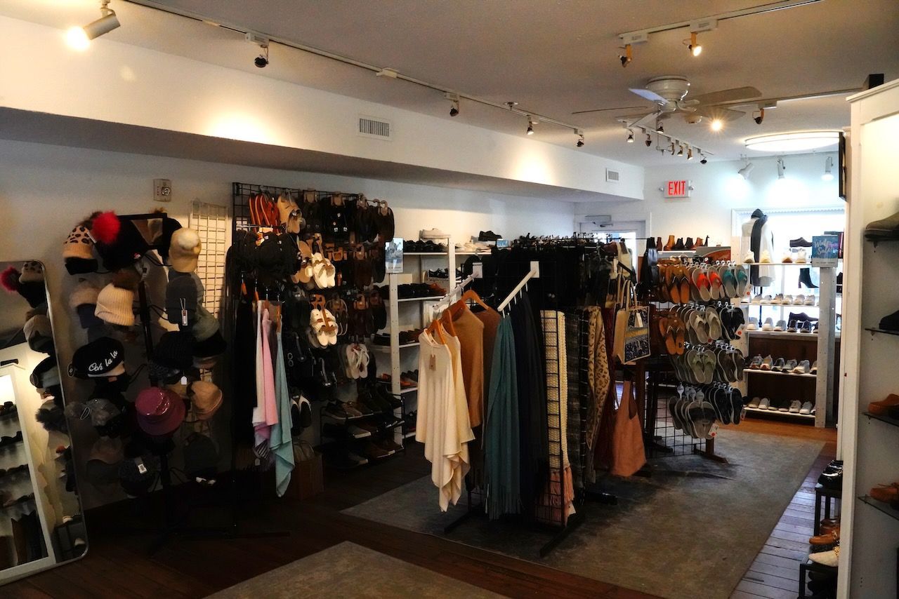 A store filled with lots of clothes and hats.