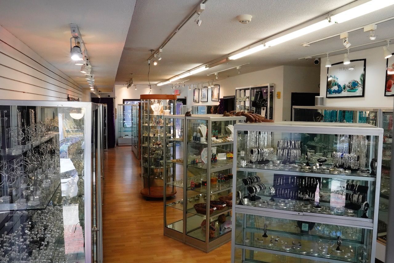 A store filled with lots of glass shelves and display cases.