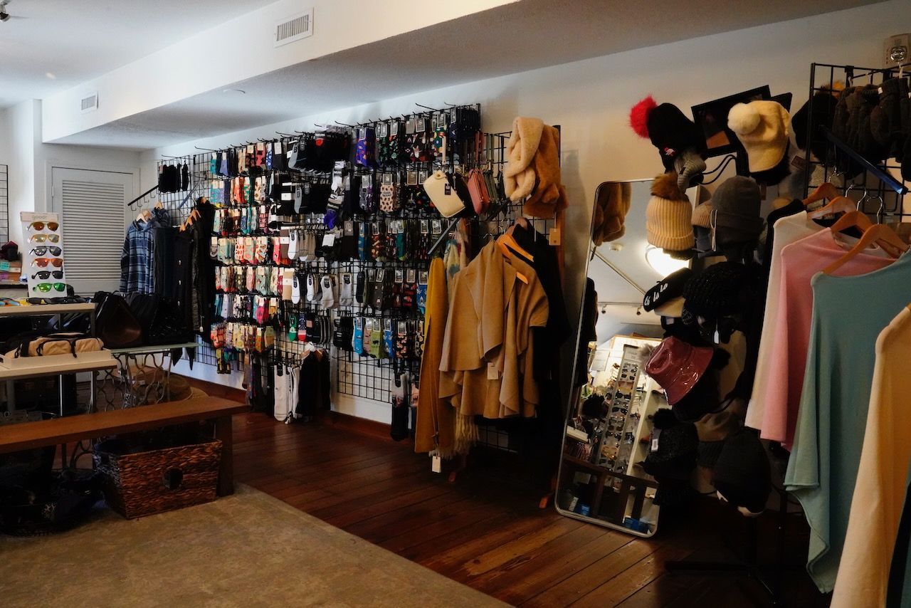A store filled with lots of clothes and hats