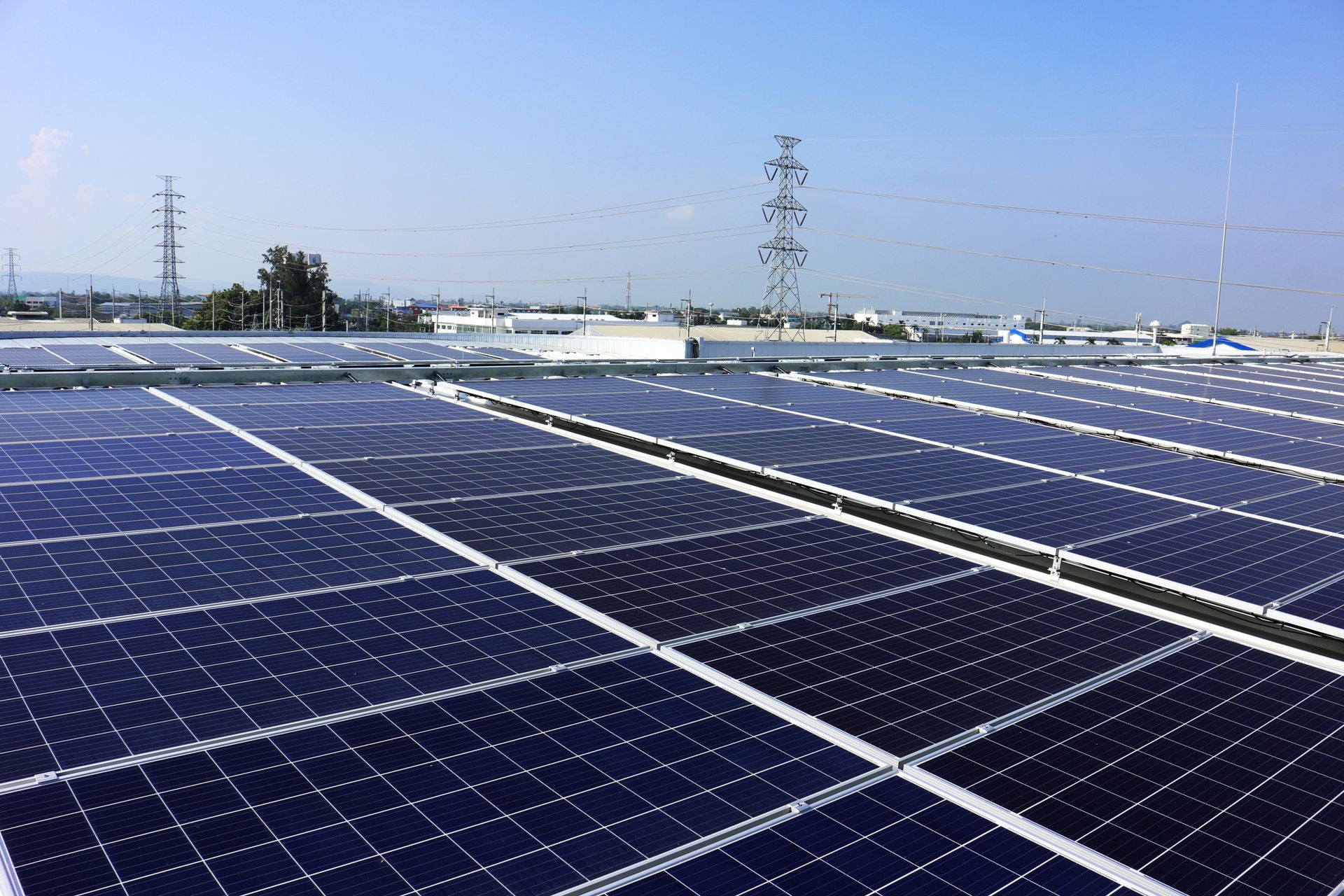 a row of solar panels on the roof of a building