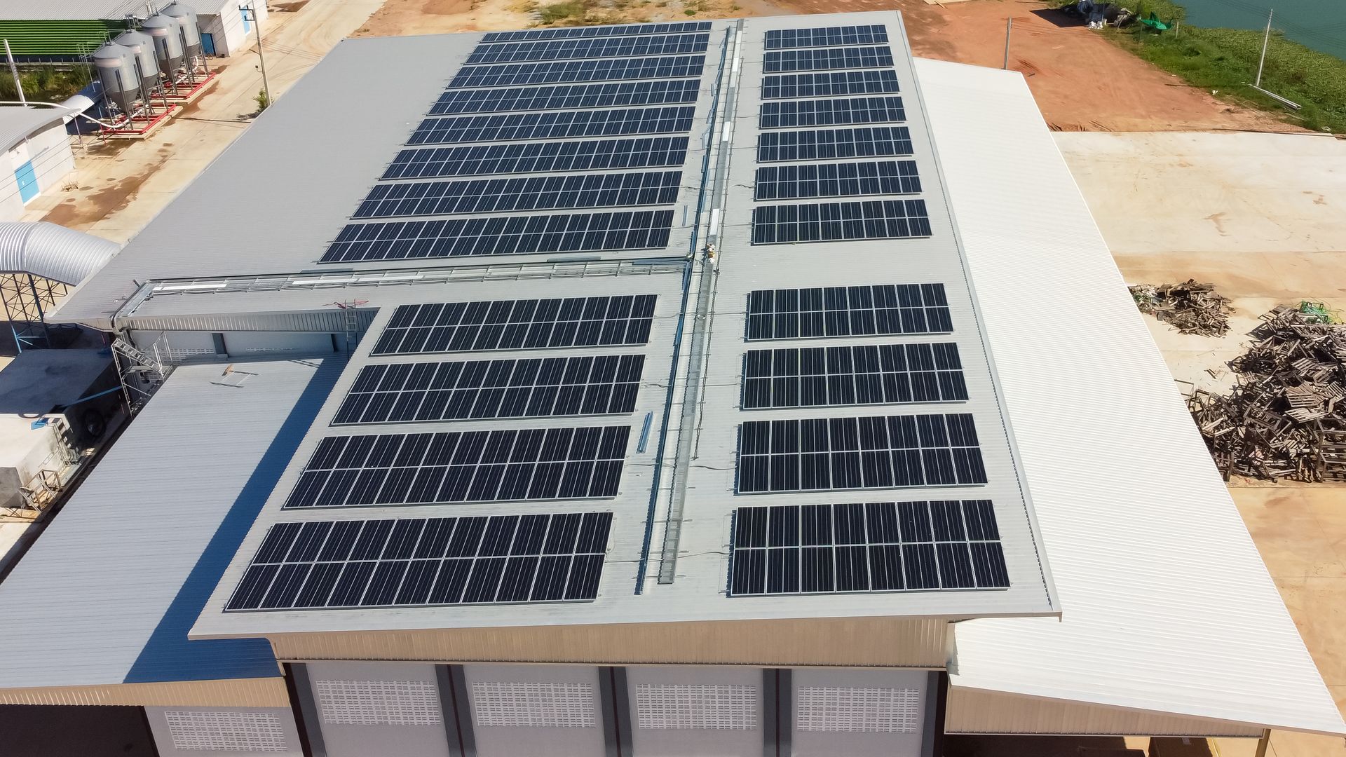 a large building with a lot of solar panels on the roof