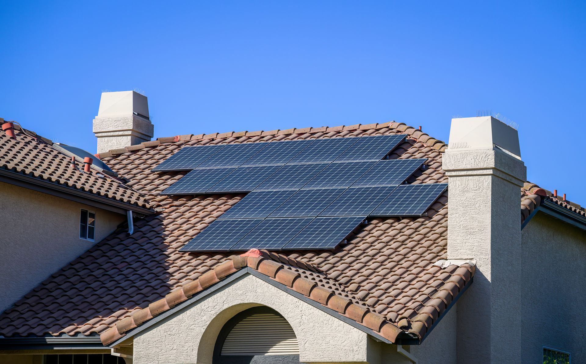 a house with solar panels on the roof