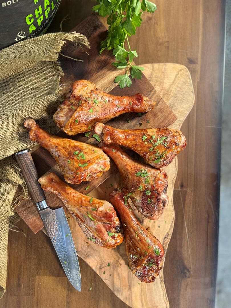 Brined Smoked Turkey Legs on a cutting board