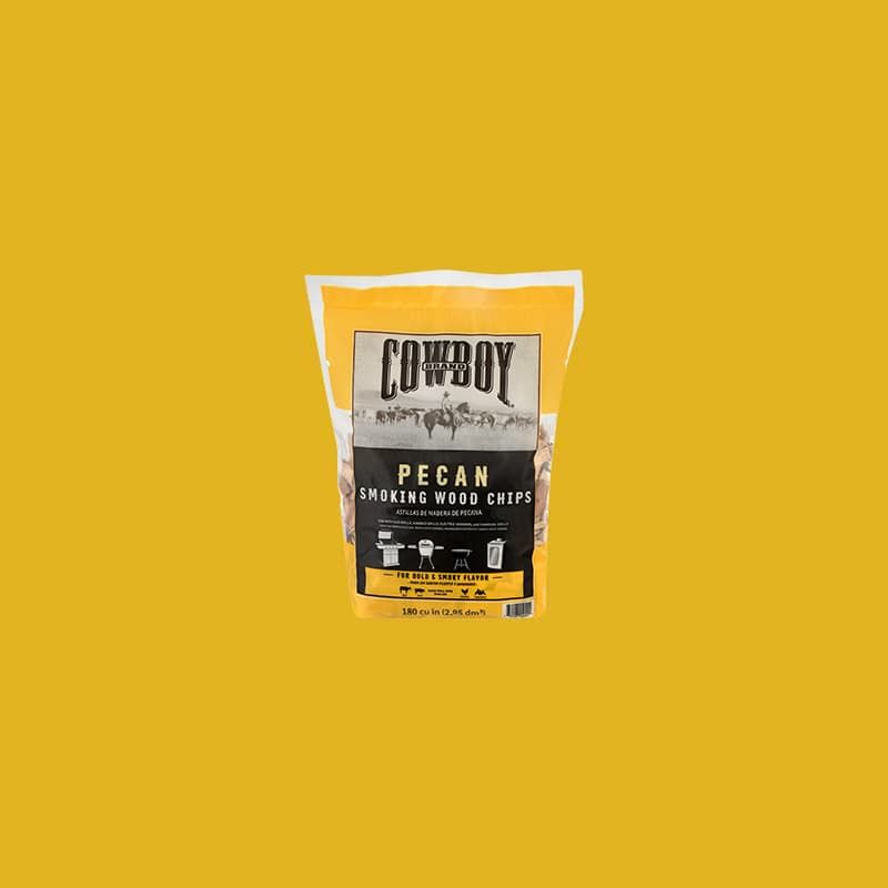 Bag of Cowboy pecan smoking wood chips against a yellow background.