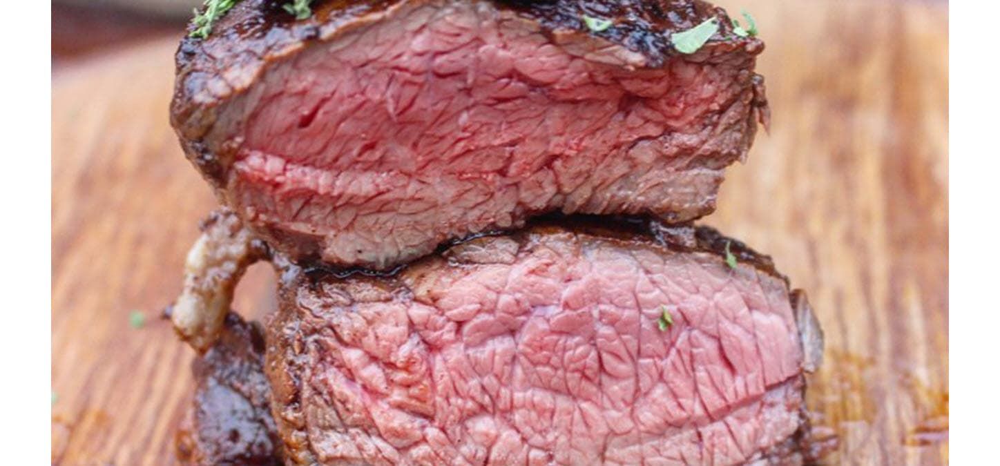 boubon and bacon filet mignon cut in half and stacked