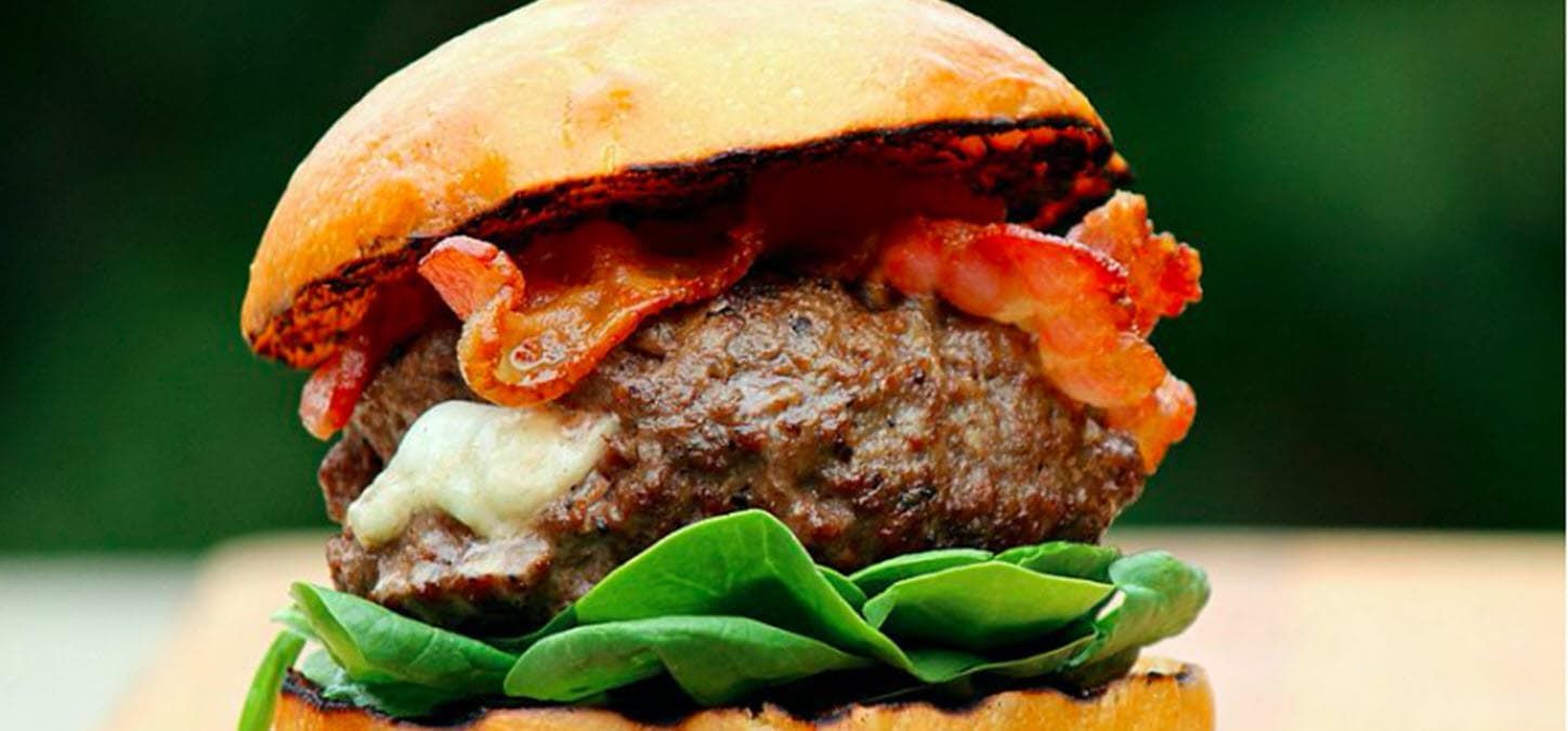 Stuffed swiss and mushroom burger with bacon and lettuce