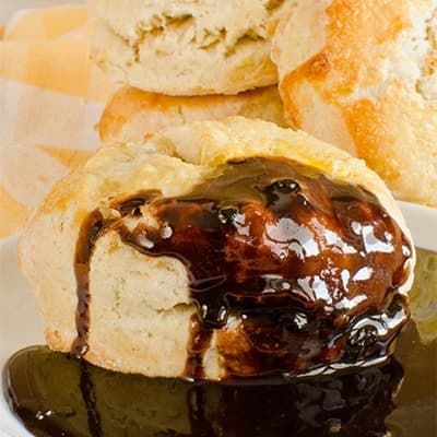 Arkansas Chocolate Gravy poured over a biscuit.