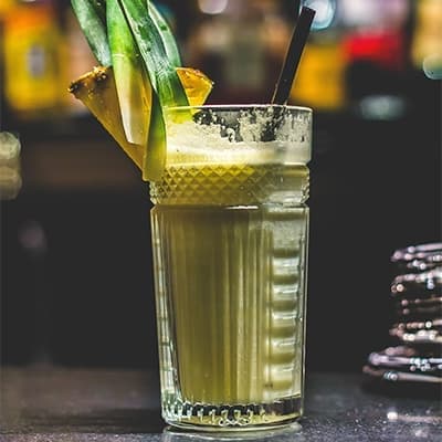 Grilled Colada Cocktail in tall glass with garnish