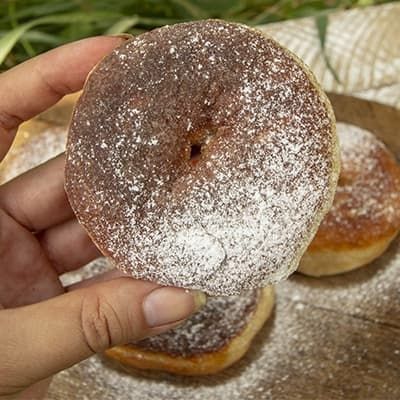 cowboy donut sprinkled with powdered sugar