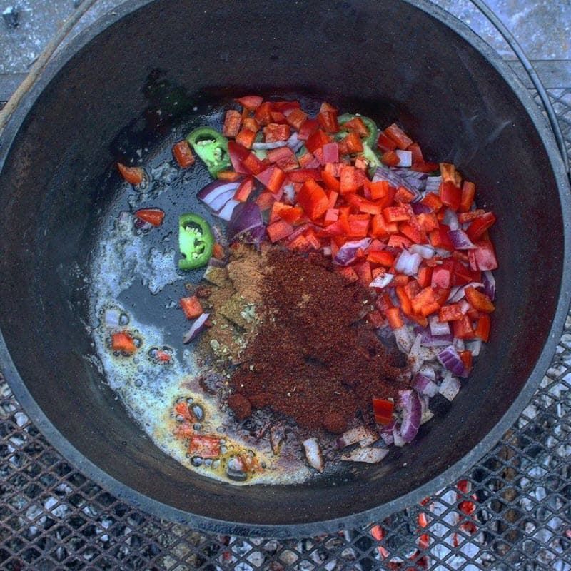 fall festive chili raw ingredients in cast iron pan