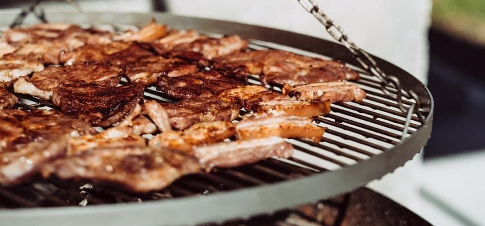 Pork chops cooking on the grill