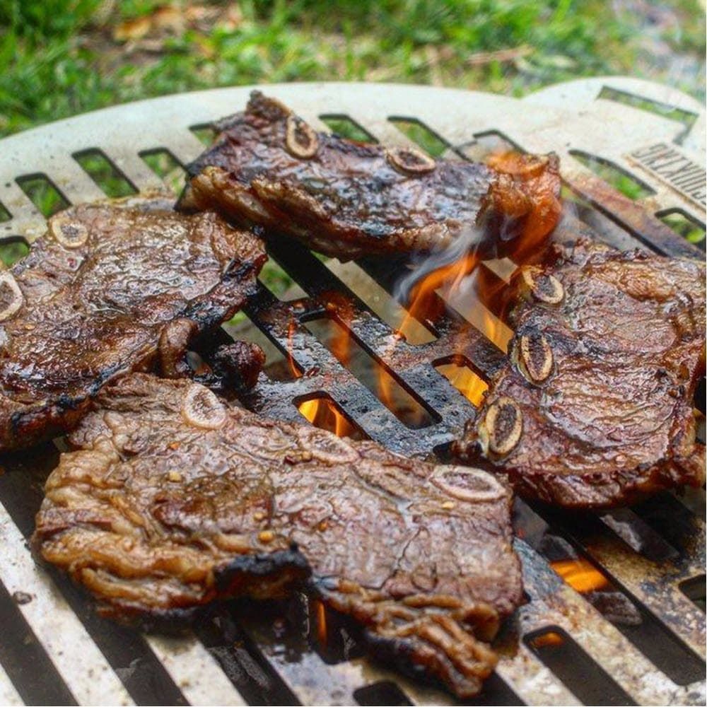 korean bbq short ribs cooking on the grill